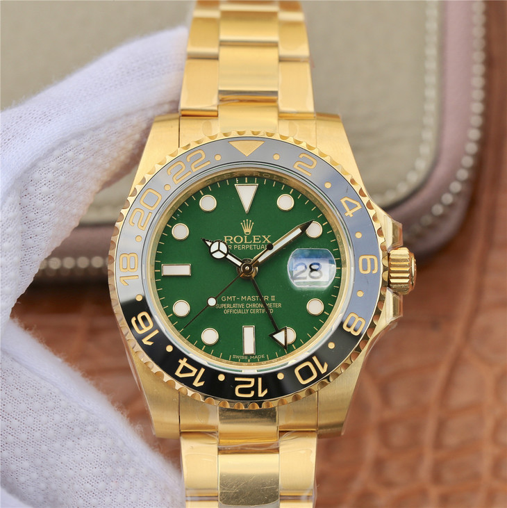yellow gold gmt green dial